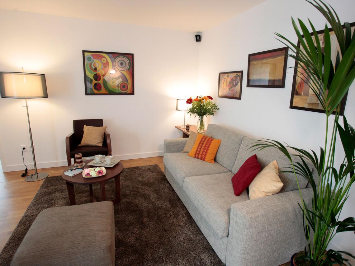  : Salon d'un appartement de la résidence Cour des Lys
